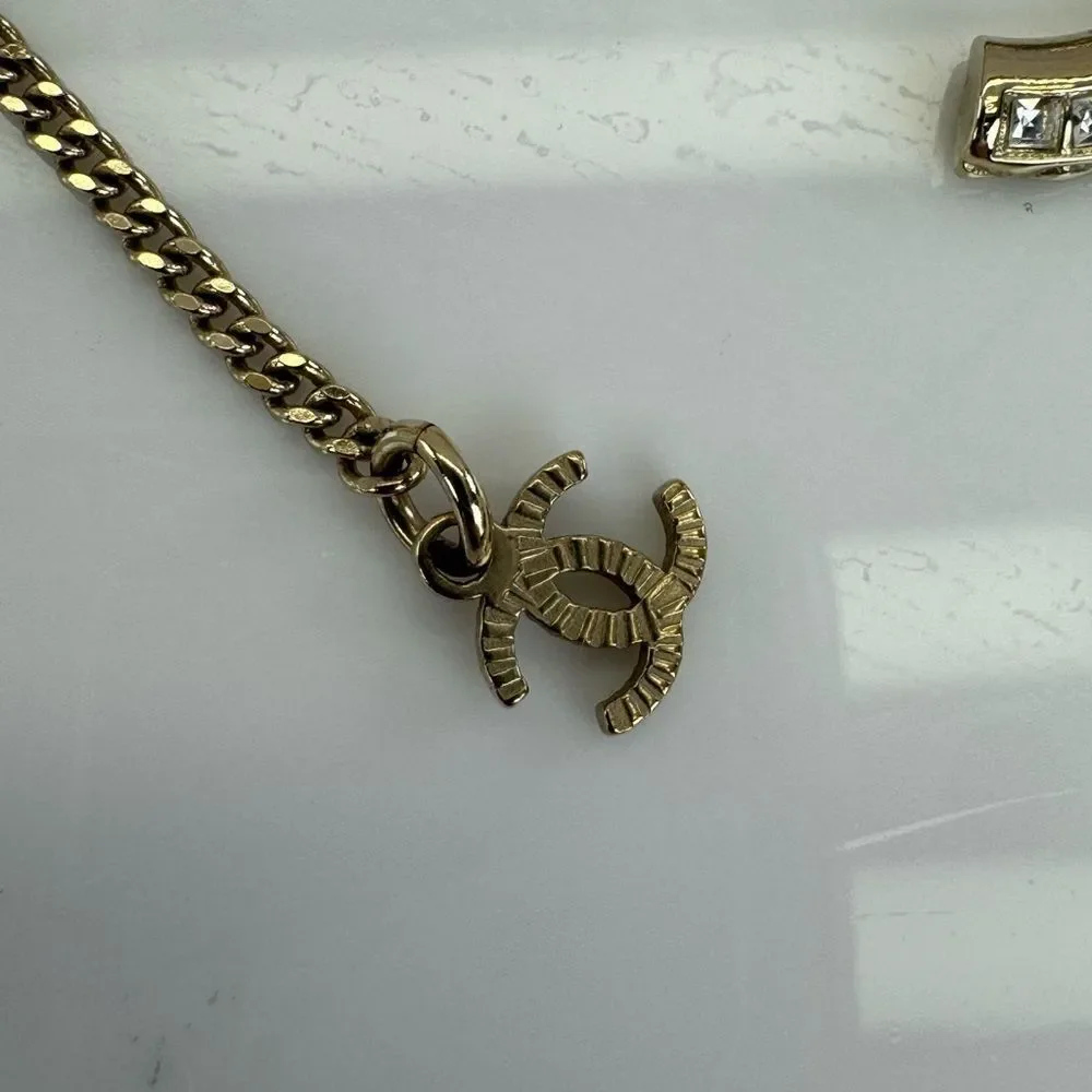 CHANEL Multi Logo Engraved Gold Crystal CC Pendant Necklace